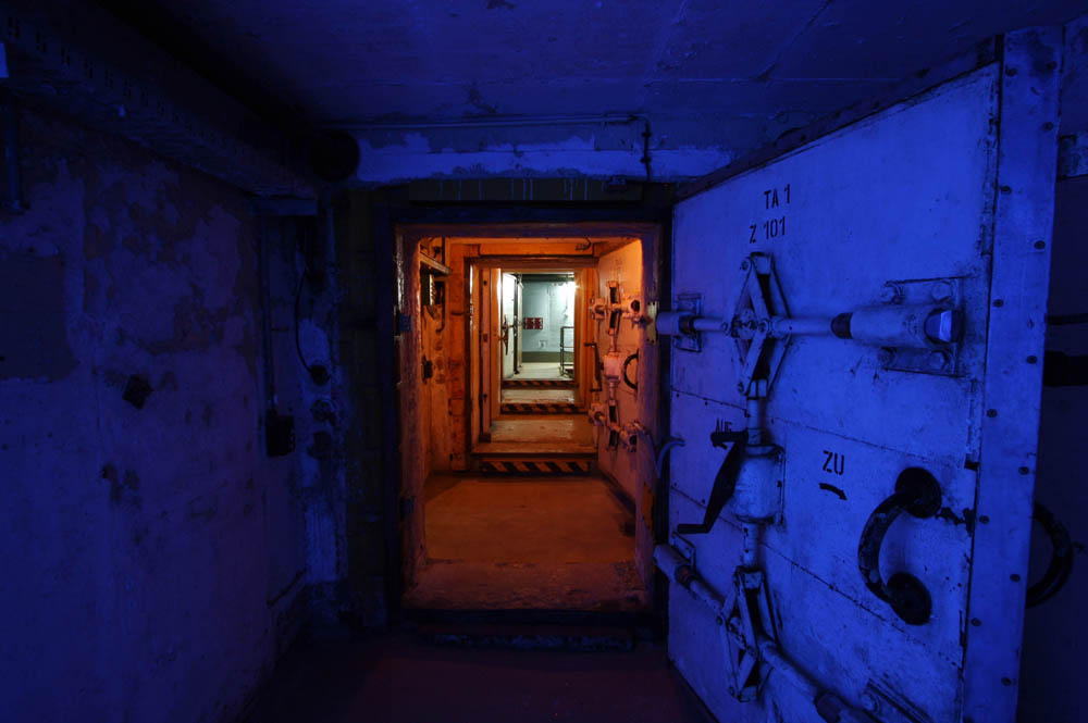 Main entrance seen from outside the bunker. The corridor having a darkblue glow.